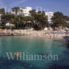 GW22465-50 = View over Cala Dor ( original cala ) with luxury traditional Cala Dor Hotel, Cala Dor resort, SE Mallorca, Balearic Islands, Spain. 