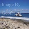 GW17495-50 = Robinson R22 helicopter operated by Sloane Helicopters taking off from a deserted beach in Formentera near Ibiza, Balearic Islands, Spain. August 1996. 