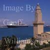 GW17850-50 = Historic lighthouse of Porto Pi (also a lighthouse museum) with Cruise liner Queen Mary 2 (QM2), Port of Palma de Mallorca, Balearic Islands, Spain. 