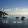 GW11225-50 = Late afternoon sea and boat scape at San Telmo, SW Mallorca, Balearic Islands, Spain. (Note. The Spanish name San Telmo is increasingly being replaced on maps and in guides by the Mallorquin version of Sant Elm).