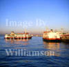 GW03090-32 = Early morning commuter ferries arriving at Praca do Comercio ferry terminal on River Tagus, Lisbon, Portugal.