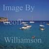 GW19790-50 = Scene in Cala Varques ( with leisure craft + lilo lady ) South of Porto Cristo, SW. Mallorca, Balearic Islands, Spain.