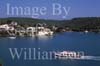 GW20990-50 = Scene (looking North) with sailing boat, water side villas and tourist boat in the approaches to the Port of Mahon, Menorca, Baleares, Spain.