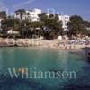 GW22465-50 = View over Cala Dor ( original cala ) with luxury traditional Cala Dor Hotel, Cala Dor resort, SE Mallorca, Balearic Islands, Spain. 24th June 2005.