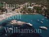 GW24566-50 = Aerial image ( with beach, bay, island restaurant and pleasure craft ) of Camp de Mar, Andratx, SW Mallorca, Balearic Islands, Spain.
