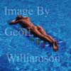 GW25276-50 = Young nude lady floating on a lilo in the swimming pool of a country finca, Mallorca, Balearic Islands, Spain.