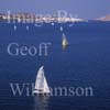 GW27520-60 = Aerial view -sailing in Cala Fornells ( Badia de Fornells ) - an almost fully enclosed sea bay and mecca for sailing - Fornells in background at the mouth of the Cala, North Coast Menorca, Balearic Islands, Spain. 20th September 2006. 