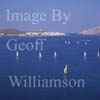 GW27555-60 = Aerial view -sailing in Cala Fornells ( Badia de Fornells ) - an almost fully enclosed sea bay and mecca for sailing - Fornells in background at the mouth of the Cala, North Coast Menorca, Balearic Islands, Spain. 20th September 2006. 