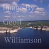 GW27910-60 = Aerial view - remote coastline with cliffs, wooded hinterland and sandy cala / bay / anchorage - South West Menorca, Balearic Islands, Spain. 20th September 2006. 