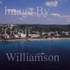 GW27935-60 = Aerial view - please craft sailing past the beach resort of Santa Tomas - South Coast Menorca, Balearic Islands, Spain. 20th September 2006. 