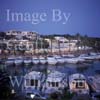 GW29575-60 = Looking North East at dusk over moored motor yachts and restaurant / offices area in Cala D'Or Marina, Cala D'Or, Santanyi, South East Mallorca, Balearic Islands, Spain. 7th July 2007.