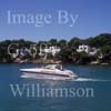 GW29615-60 = Morning scene looking South near entrance to Cala D'Or Marina - with luxury Alfamarine 50 "Passione" motor yacht passing luxury coastal properties - Cala D'Or, Santanyi, South East Mallorca, Balearic Islands, Spain. 7th July 2007.