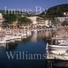GW29805-60 = Scene in Puerto Soller marina - moored traditional Mallorquin wooden llauts and promenade - North Mallorca, Balearic Islands, Spain. 15th July 2007.