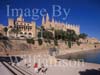 GW30050-60 = Historic Gothic Cathedral ( also known as La Seu ) - the major landmark to dominate Palma plus Almudaina Royal Palace, Parc de La Mar lake, , promenade and lakeside scupture in the forground with tourists. The Cathedral was built between 1230 and 1601, Palma de Mallorca, Balearic Islands, Spain. 5th September 2007.