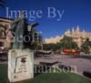 GW30070-60 = Monument to Ramon Llull ( 1235-1316 ) a famous scholar of Palma with Almudaina Royal Palace and historic Gothic Cathedral ( also known as La Seu and built between 1230 and 1601 ) plus red open topped tourist bus and tourists, Palma de Mallorca, Balearic Islands, Spain.5th September 2007.