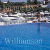 GW30150-60 = Scene at Cala D'Or Yacht Club - swimmer diving into pool - overlooking Marina of Cala D'Or, Cala D'Or, Ajuntamiento de Santanyi, South East Mallorca, Balearic Islands, Spain. 11th September 2007. Model Release.