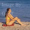 GW30731-60 = Young lady performing pre swim yoga, fitness, exercise and meditation at Puerto Alcudia beach, North East Mallorca, Balearic Islands, Spain. 11th November 2007. Model Release.