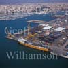 GW31130-60 = Aerial view over the Commercial Quay ( with ISCOMAR line freighter / Ro-Ro cargo ferry "BENIRREDA", container, and drive on drive off cargo operations looking towards the marinas and City of Palma ) in the Port of Palma de Mallorca, Balearic Islands, Spain. 15th August 2003.