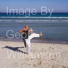 GW31855-60 = Professional Tai Chi and Kong Fu Instructor working out on a beach in Mallorca, Spain.