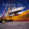 GW32245-60 = Johnson 77 luxury motor yacht / superyacht during lift off from container vessel "OPDR Tanger" - with two heavy lift cranes in attendance - in the Port of Palma de Mallorca, Balearic Islands, Spain.8th April 2008.