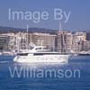 GW32325-60 = Boat Show Bound - Sanlorenzo SL88 motor yacht ( with Paseo Maritimo in the background ) heading for Palma International Boat Show 2008 in Old Port ( Moll Vell / Muelle Viejo ) Area of the Port of Palma de Mallorca, Balearic Islands, Spain. 24th April 2008.