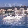 GW32335-60 = Boat Show Bound - Princess V-70 motor yacht ( with Belver Castle and Paseo Maritimo in the background ) heading for Palma International Boat Show 2008 in Old Port ( Moll Vell / Muelle Viejo ) Area of the Port of Palma de Mallorca, Balearic Islands, Spain. 24th April 2008.