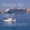 GW32355-60 = oat Show Bound ???- traditional Balearic wooden llaut ( with Aidacara cruise ship in the background ) heading for Palma International Boat Show 2008 in Old Port ( Moll Vell / Muelle Viejo ) Area of the Port of Palma de Mallorca, Balearic Islands, Spain. 24th April 2008.