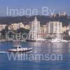 GW32370-60 = Boat Show Bound ???- traditional Balearic wooden llaut ( with Belver Castle and Paseo Maritimo in the background ) heading for Palma International Boat Show 2008 in Old Port ( Moll Vell / Muelle Viejo ) Area of the Port of Palma de Mallorca, Balearic Islands, Spain. 24th April 2008.