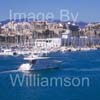 GW32375-60 = Boat Show Bound ???- motor yacht with Real Club Nautico de Palma in the background ) heading for Palma International Boat Show 2008 in Old Port ( Moll Vell / Muelle Viejo ) Area of the Port of Palma de Mallorca, Balearic Islands, Spain. 24th April 2008.