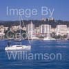 GW32385-60 = Boat Show Bound ???- sailing yacht ( with Belver Castle and Paseo Maritimo in the background ) heading for Palma International Boat Show 2008 in Old Port ( Moll Vell / Muelle Viejo ) Area of the Port of Palma de Mallorca, Balearic Islands, Spain. 24th April 2008.