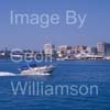 GW32395-60 = Boat Show Bound - Princess Riviera motor yacht with historic Porto Pi lighthouse in the background heading for Palma International Boat Show 2008 in Old Port ( Moll Vell / Muelle Viejo ) Area of the Port of Palma de Mallorca, Balearic Islands, Spain. 24th April 2008.