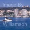 GW32400-60 = Boat Show Bound  - Rodman 1040 motor boat ( with Belver Castle and Paseo Maritimo in the background ) heading for Palma International Boat Show 2008 in Old Port ( Moll Vell / Muelle Viejo ) Area of the Port of Palma de Mallorca, Balearic Islands, Spain. 24th April 2008.