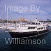 GW32515-60 = Scene with 23.5 mtr MARLOW EXPLORER 78E motor yacht in the foreground and Palma Cathedral in the background at the Palma International Boat Show 2008, Port of Palma de Mallorca, Balearic Islands, Spain. 1st May 2008.