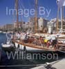 GW33320-60 = Scene in regatta village on Paseo Maritimo - No. 7 " AVEL 1896" taking on stores - during the XXIV TROFEO ALMIRANTE CONDE DE BARCELONA - Conde de Barcelona Classic Boats Sailing Regatta, Palma de Mallorca, Balearic Islands, Spain on race day one. 13th August 2008.