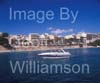 GW33665-60 = Scene in Porto Cristo with sunseeker pleasure craft / boat / motor yacht entering Porto Cristo marina and with sandy beach and resort in the background, East Coast Mallorca / Majorca, Balearic Islands, Spain. 5th October 2008.