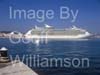 GW33815-60 = Royal Caribbean International Cruise Ship "Navigator of the Seas" ( 311 meters ) departing the Port of Palma de Mallorca with Cruise Ship "Island Escape" and historic Belver Castle in the background, Balearic Islands, Spain. 21st October 2008.