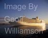 GW33860-60 = P&O Line cruise liner Arcadia entering port at sunrise ( passing the historic Gothic Palma Cathedral ) - Port of Palma de Mallorca, Balearic Islands, Spain. 18th November 2008.