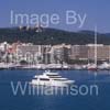 GW34000-60 = Luxury superyacht Johnson 105 ( 32 mtrs "White Shark" ) en route for Palma International Boat Show 2009 -  passing historic Bellver Castle and Paseo Maritimo, Palma de Mallorca / Majorca, Balearic Islands, Spain. 23rd April 2009.