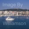 GW34105-60 = Motor Yacht en route for Palma International Boat Show 2009, with historic Bellver Castle and Paseo Maritimo in the background, Palma de Mallorca / Majorca, Balearic Islands, Spain. 23rd April 2009.