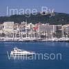 GW34110-60 = Motor Yacht en route for Palma International Boat Show 2009, with historic Bellver Castle and Paseo Maritimo in the background, Palma de Mallorca / Majorca, Balearic Islands, Spain. 23rd April 2009.