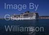 GW34320-60 = MSC Cruise Ship "Fantasia" entering the Port of Palma de Mallorca ( with historic Porto Pi Lighthouse ahead and Bellver hilltop castle behind ), Balearic Islands, Spain.  30th April 2009.