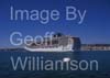 GW34325-60 = MSC Cruise Ship "Fantasia" entering the Port of Palma de Mallorca ( with historic Porto Pi Lighthouse ahead and Bellver hilltop castle behind ), Balearic Islands, Spain.  30th April 2009.