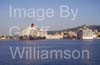 GW34405-60 = Cunard Line Cruise Ship "Queen Victoria" coming onto berth with historic Porto Pi lighthouse on LHS, Acciona ferry ahead and Cruise Ship Costa Atlantica on RHS, in the Port of Palma de Mallorca, Balearic Islands, Spain. 11th May 2009.