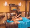 GW34475-60 = Young lady enjoying a warm stones massage at Biomar Spa and Wellness Centre, Sa Coma, East Coast  Mallorca ( Majorca ), Balearic Islands, Spain. 17th August 2009. Model Release.