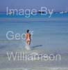 GW34815-60 = Young bikin clad lady enjoying sun, sea and sand on Es Trenc beach ( with boats anchored in the background ) in SE Mallorca / Majorca, Balearic Islands, Spain.  17th August 2009. Model Release.