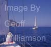 GW35811-60 = Formentor Headland and Lighthouse ahead - Sailing in North East Mallorca with A1 Sailing -on sailing yacht xxx in company with sailing yacht Indulgence (Jeanneau Sun Odyssey 36) - near Alcudia and Pollensa, Mallorca Balearic Islands, Spain.  13th July 2010. Model Releases.