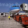 GW13545-50 = Scene at Palma de Mallorca Airport ( Tui / Britannia Boeing 757-204 Registration G-BYAT commencing pushback under the guidence of Iberia lady despatcher ), Baleares, Spain.