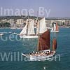 GW06590 = Tomi (No.48) + Thopago (No.6) sailing out to join the Conde de Barcelona Classic Boats Regatta (Paseo Maritimo and Belver Castle behind), Palma de Mallorca, Baleares, Spain. 26 Aug 2000.