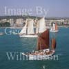 GW06590-50 = Tomi (No.48) + Thopago (No.6) sailing out to join the Conde de Barcelona Classic Boats Regatta (Paseo Maritimo and Bellver Castle behind), Palma de Mallorca, Baleares, Spain. 26 Aug 2000.